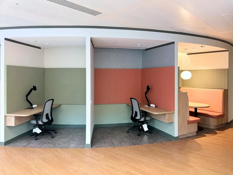 Recessed desks and seating within the shared office