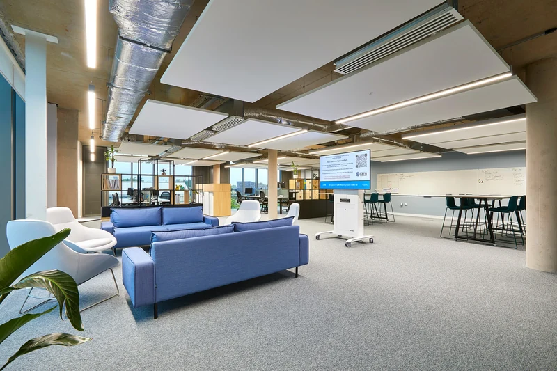 Shared seating and informal meeting areas beside the windows