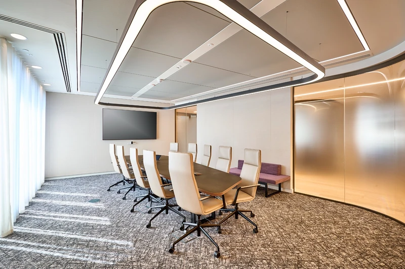 Full-height room enclosures and a coordinated ceiling layout