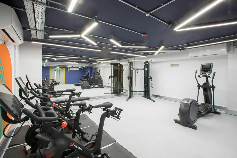 A completed exercise space within the workplace amenity suite