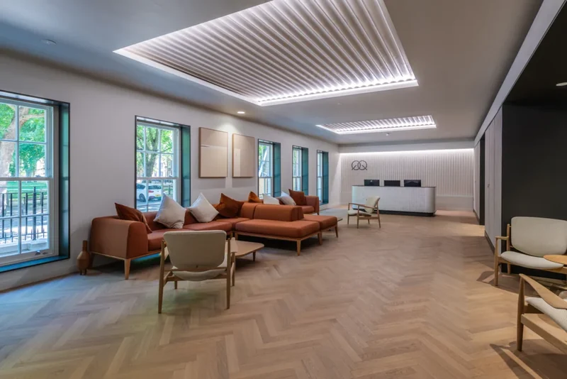 Recessed ceiling features above the finished reception space