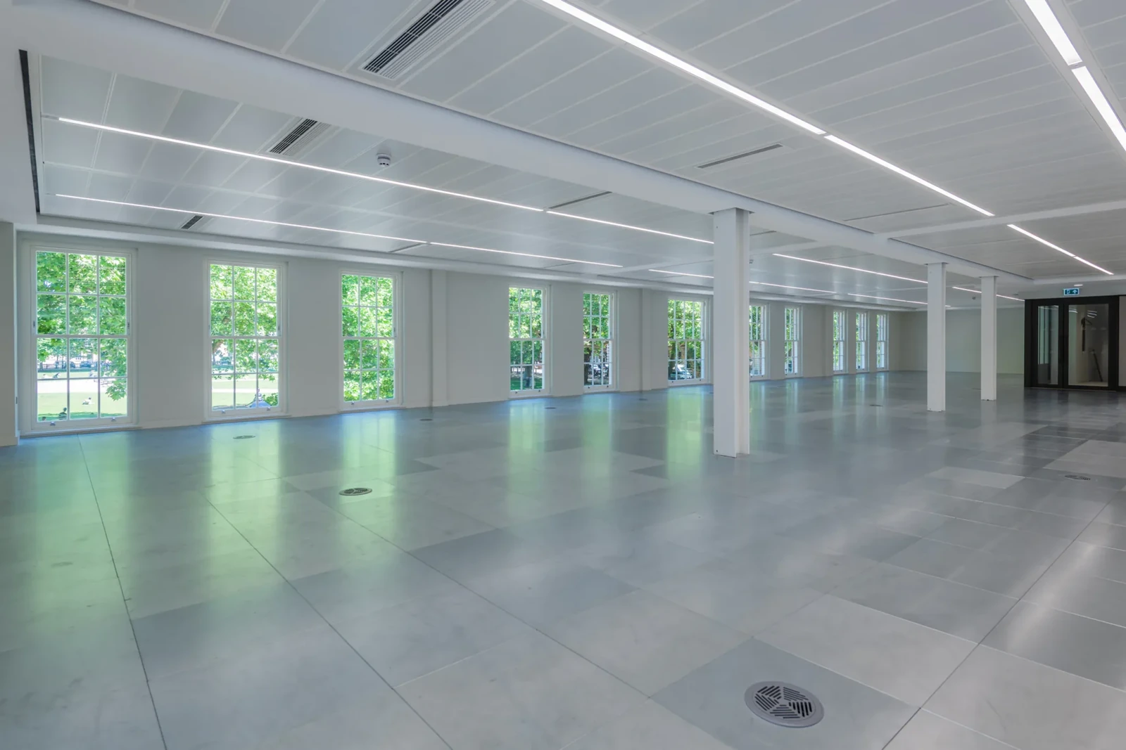 A consistent ceiling grid across the open-plan office